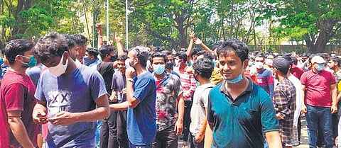 Students staging protest in front of the Academic Building on Tuesday | Express