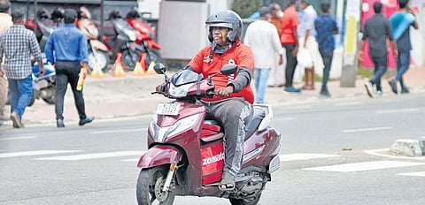 A Zomato food delivery executive is on his way to deliver an order at MG Road in Thiruvananthapuram | B P Deepu