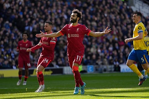 Liverpool's Mohamed Salah celebrates after scoring his side's second goal on a penalty kick during the English Premier League.  (Photo | AP)