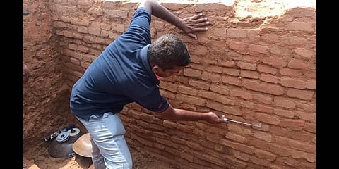 An ancient clay pot and a brick structure were unearthed during excavation at Maligaimedu in Ariyalur district | Express