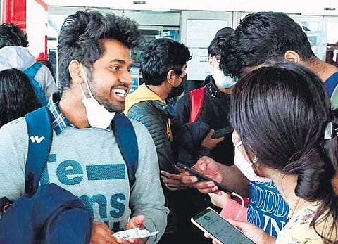 Students from Ukraine at the Delhi airport on Wednesday before boarding the chartered flight to Kochi