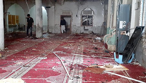 A powerful bomb exploded inside a Shiite Muslim mosque in Pakistan's northwestern city of Peshawar  killing more than 30 worshippers and wounding dozens more. (Photo | AP)