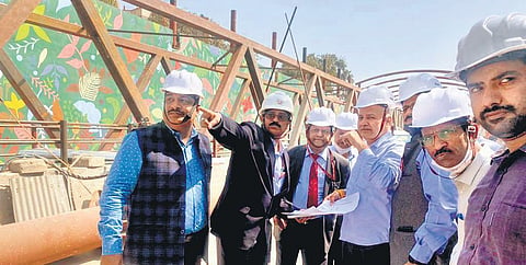 Deputy CM Manish Sisodia with PWD officials at the construction site.  (Photo | EPS)