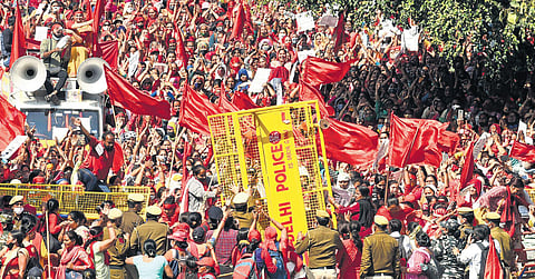 Anganwadi workers demanding rise in salary protest against Delhi government at Raj Ghat on International Women’s Day on Tuesday, March 8, 2022. (Photo | EPS, Parveen Negi)