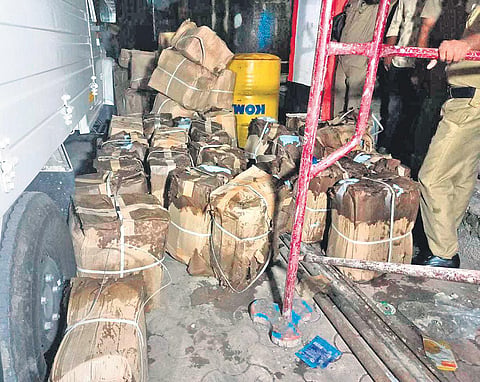 Cans containing spirit seized by the Excise from the underground rainwater tank  of JK Enterprise at the Edayar industrial area near Aluva | EXPRESS
