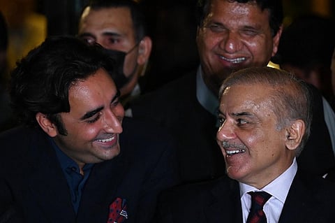 Pakistan's opposition leader Shahbaz Sharif (R) and Bilawal Bhutto Zardari smile during a press conference. (Photo | AFP)