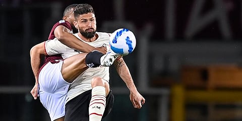 Torino's Bremer (L) and AC Milan's Olivier Giroud battle for the ball during the Serie A soccer match between Torino Fc and AC Milan at Olimpico Grande Torino stadium in Turin, Italy. (Photo | AP)