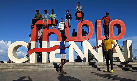People climb over the Namma Chennai  selfie structure at Kamarajar Promenade  in Chennai. (Photo | Debadatta Mallick, EPS)