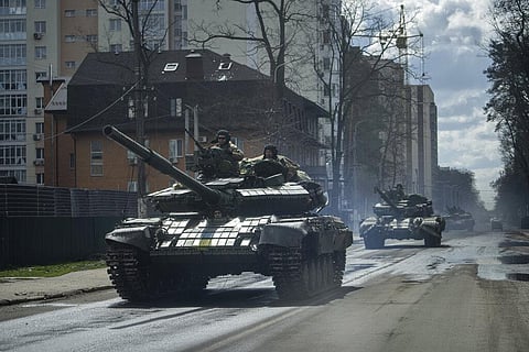 Ukrainian tanks move in a street in Irpin, in the outskirts of Kyiv, Ukraine, Monday, April 11, 2022. (Photo | AP)