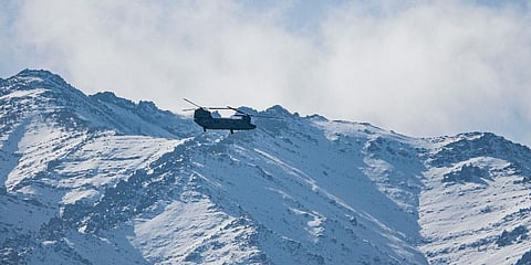 IAF Chinook helicopter flies over Ladakh region in Leh. (Photo | AP)