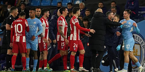 Manchester City's Jack Grealish (R) argues with Atletico Madrid's Angel Correa (L) during the Champions League, first leg, quarterfinal match at the Etihad Stadium, in Manchester. (Photo | AP)