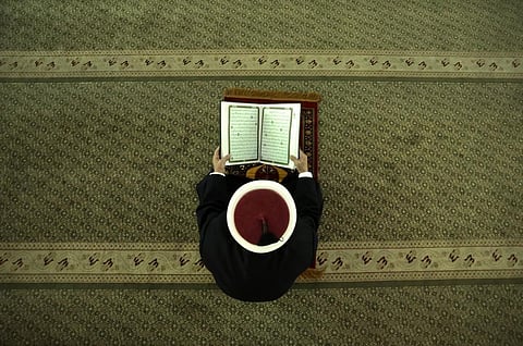 A cleric seen reading the Koran. (AFP)