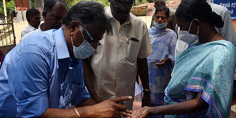 TNHB residents' association members affixing thier thumb impression in blood. (Photo| EPS)