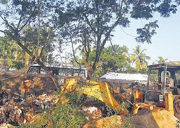 Officials carry out a special cleaning drive at the land owned by Navy near airport