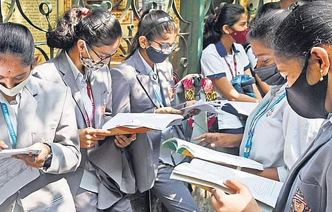 PU students make last-minute preparations ahead of their exams at a college in Bengaluru on Friday | Vinod Kumar.T 