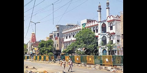 Policemen patrol in violence-hit Jahangirpuri area on Saturday.(Photo  | PTI)