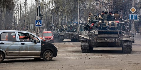Russian tanks roll along a street in an area controlled by Russian-backed separatist forces in Mariupol, Ukraine. (Photo | AP)