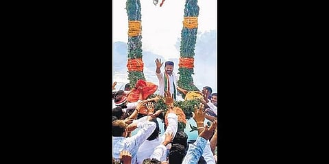 Congress supporters accord a flowery welcome to   A Revanth Reddy at Nayakangudem village on Tuesday