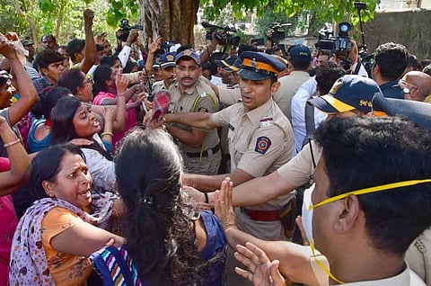 Police in a scuffle with employees of  MSRTC as they protest demanding the merger of the MSRTC with the state government, outside the residence of NCP Chief Sharad Pawar's residence. (Photo | PTI)