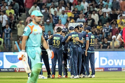 Gujarat Titans players celebrate the wicket of Marcus Stoinis of Lucknow Super Giants, during IPL on Tuesday. (Photo | PTI)