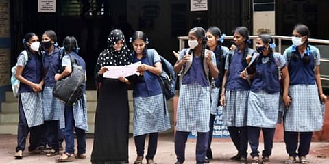 Students studying Plus one return after the annual exam on the first day at Presidency Girls Higher Secondary School in Chennai. (Photo| P Jawahar, EPS)