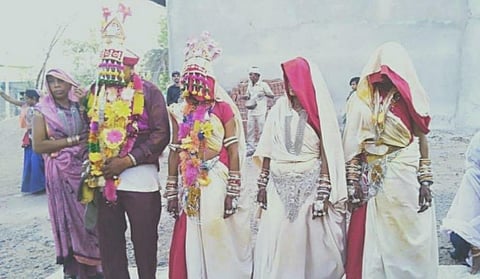 The former sarpanch of Nanpur village in Alirajpur district, Samrath Maurya, who is in his early 40s, married all his three live-in partners. (Photo | Special Arrangement)