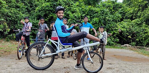 Manulal on his Recumbent model bicycle.(Photo | EPS)