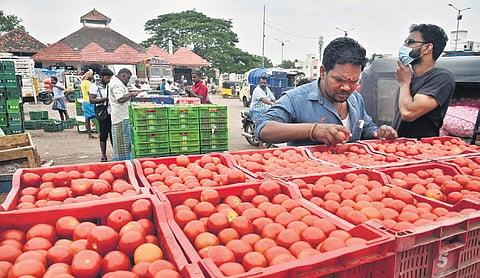 Tomatoes being unloaded at Koyambedu vegetable market on Thursday | P Jawahar