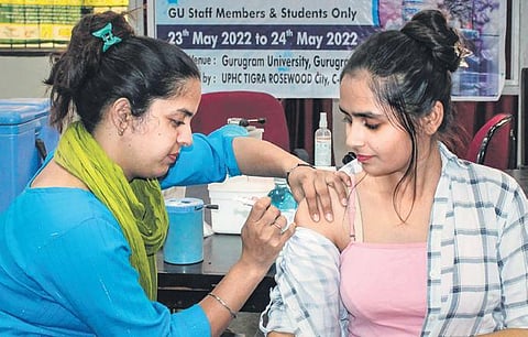 A healthcare worker administers a Covid-19 dose to a beneficiary | pti