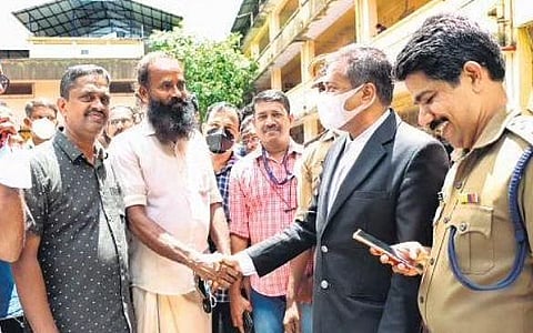 Vismaya’s father Thrivikraman Nair conveying his gratitude to prosecutor  G Mohanraj at Kollam Additional Sessions Court on Monday | Express