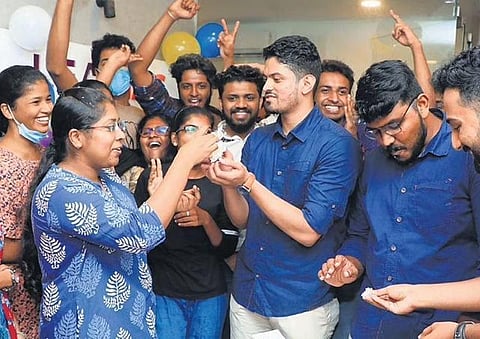 Athira S Kumar, Afnana Abdu Samad, Suresh Kumar and Sreekumar of Lead Academy, cut cake to celebrate their victory in the Civil Services Examination at the institute on Monday | B P Deepu