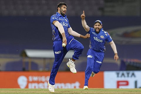 asprit Bumrah of Mumbai Indians takes the catch of Sunil Narine of Kolkata Knight Riders, during the IPL on Monday. (Photo | PTI)