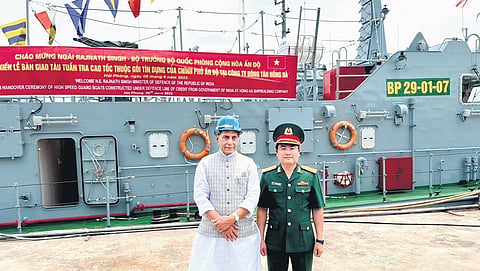 Defence Minister Rajnath Singh with  a security force personnel of Vietnam, during a ceremony to hand over 12 High Speed Guard Boats. (Photo | PTI)