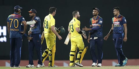 Sri Lanka's team members congratulate Australia's Matthew Wade and Jhye Richardson for their victory in the second Twenty20 cricket match  Wednesday, June 8, 2022. (AP Photo)