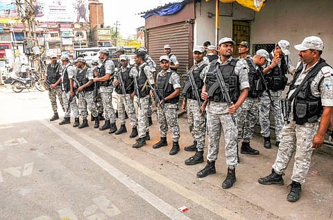 Security personnel stand alert, a day after clashes during protest against now-suspended BJP leaders' remarks on Prophet Muhammad.  (Photo | PTI)