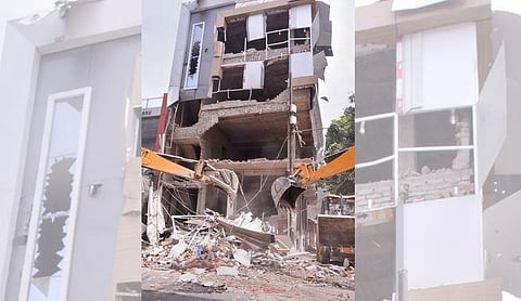 Workers use bulldozers to demolish illegal buildings, a week after Kanpur violence, in Kanpur on Saturday. PTI Photo