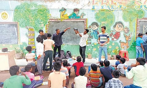 Rahul and Vikash conducting a plastic awareness workshop