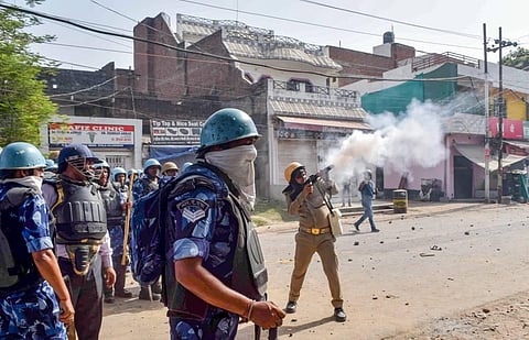 Security personnel use tear gas to disperse protestors during a protest over controversial remarks made by two now-suspended BJP leaders about Prophet Mohammad, in Prayagraj. (File Photo | PTI)