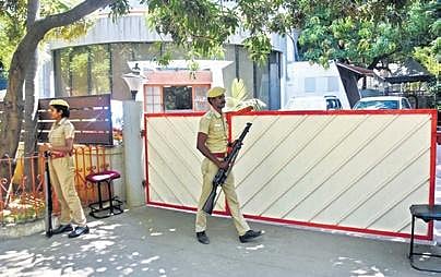 Police personnel in front of an MGM Group office in Chennai. (Photo| Ashwin Prasath, EPS)