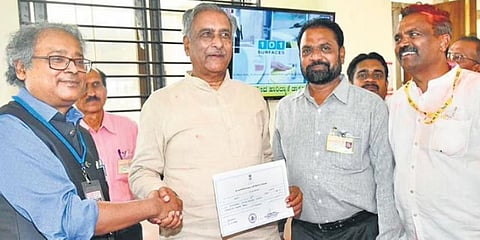​MLC Basavaraj Horatti receives the official certificate from Returning Officer Amlan Aditya Biswas after his victory in Belagavi on Wednesday | Express ​