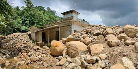 A house at Mukkulam in Kokkayar, where tonnes of soil and rubble were deposited after a landslide 