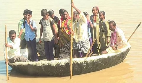Students of Kurvakarda crossing Krishna River in a boat