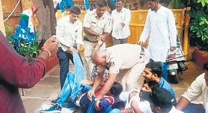 Police detain NSUI members in front of Education Minister B C Nagesh’s residence in Tiptur on Wednesday.