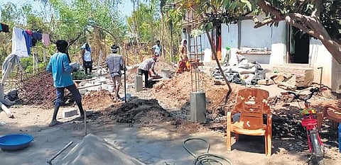 Workers engaged in the construction of a building on the land belonging to  the Lord Rama temple at Bhadrachalam. (Photo | Express)
