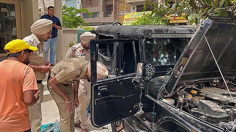 Forensic experts and police inspect the vehicle of singer Sidhu Moosewala who was slain in Mansa, Punjab, on May 29, 2022. (Photo | PTI)