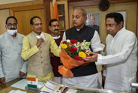Madhya Pradesh State Assembly speaker Girish Gautam greeted by Shivraj Singh Chouhan and Kamal Nath, during all-party meeting. (File Photo | PTI)