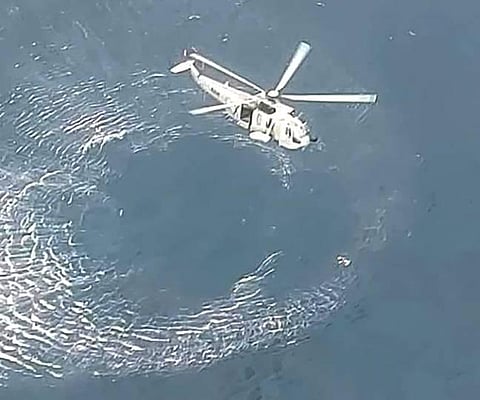 Rescue operation underway after an ONGC helicopter carrying nine persons, including two pilots, fell into the Arabian Sea off the Mumbai coast. (Photo | PTI)