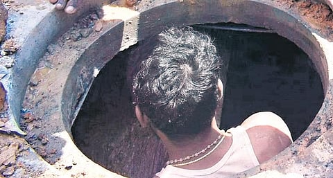 Representative image of a man cleaning a manhole | Express
