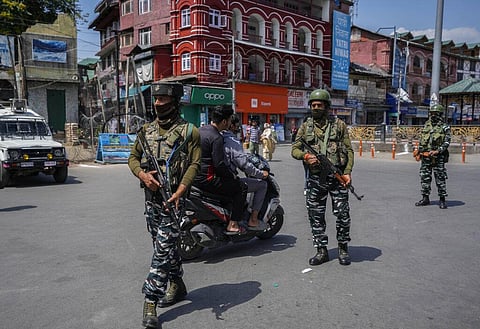 Indian paramilitary soldiers patrol in Srinagar. (Photo | AP)