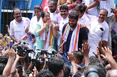 Thrikkakara MLA-elect Uma Thomas of UDF greeting party workers outside Maharaja’s College in Kochi, where the counting of votes was held, after the bypoll result was announced. (Photo | T P Sooraj, EP